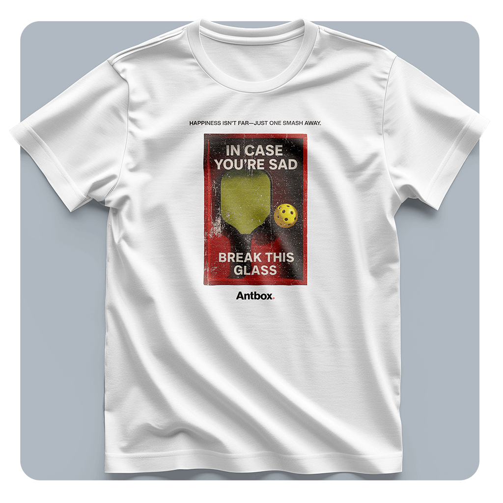 White t-shirt with a graphic design on a gray background