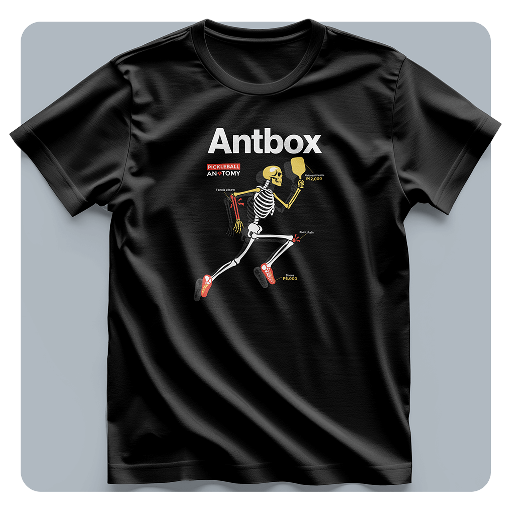 Black t-shirt with a skeleton playing tennis graphic and 'Antbox' branding on a light gray background