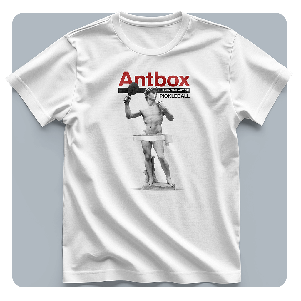 White t-shirt with 'Antbox' pickleball graphic on a gray background